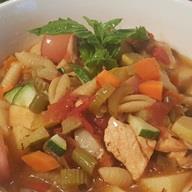 An image of Summer Minestrone with Salmon in a bowl.
